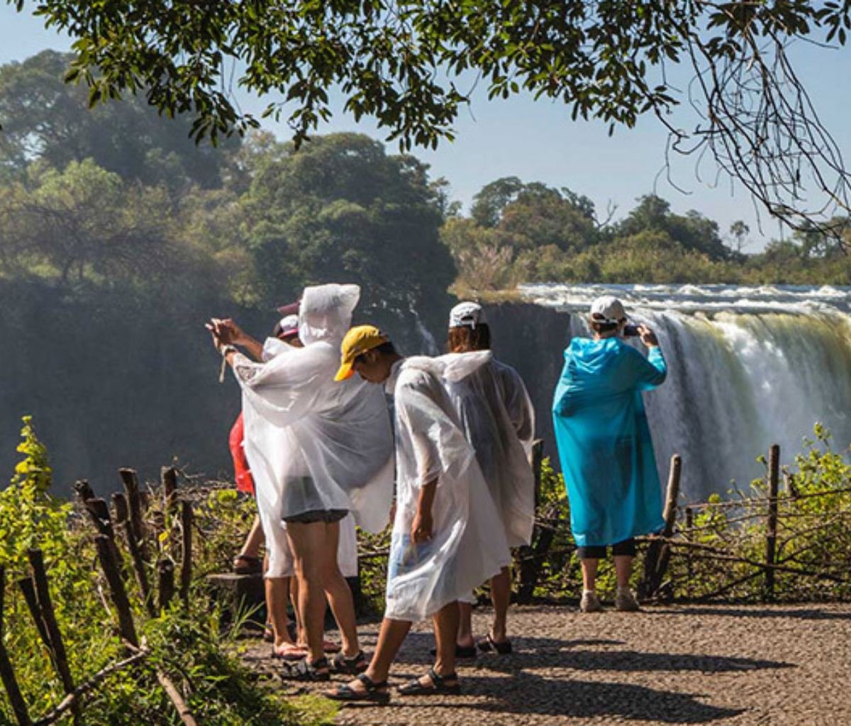 Tourists taking in Victoria Falls waterfalls