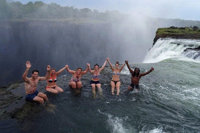 Guests in awe at Devil’s Pool, Victoria Falls