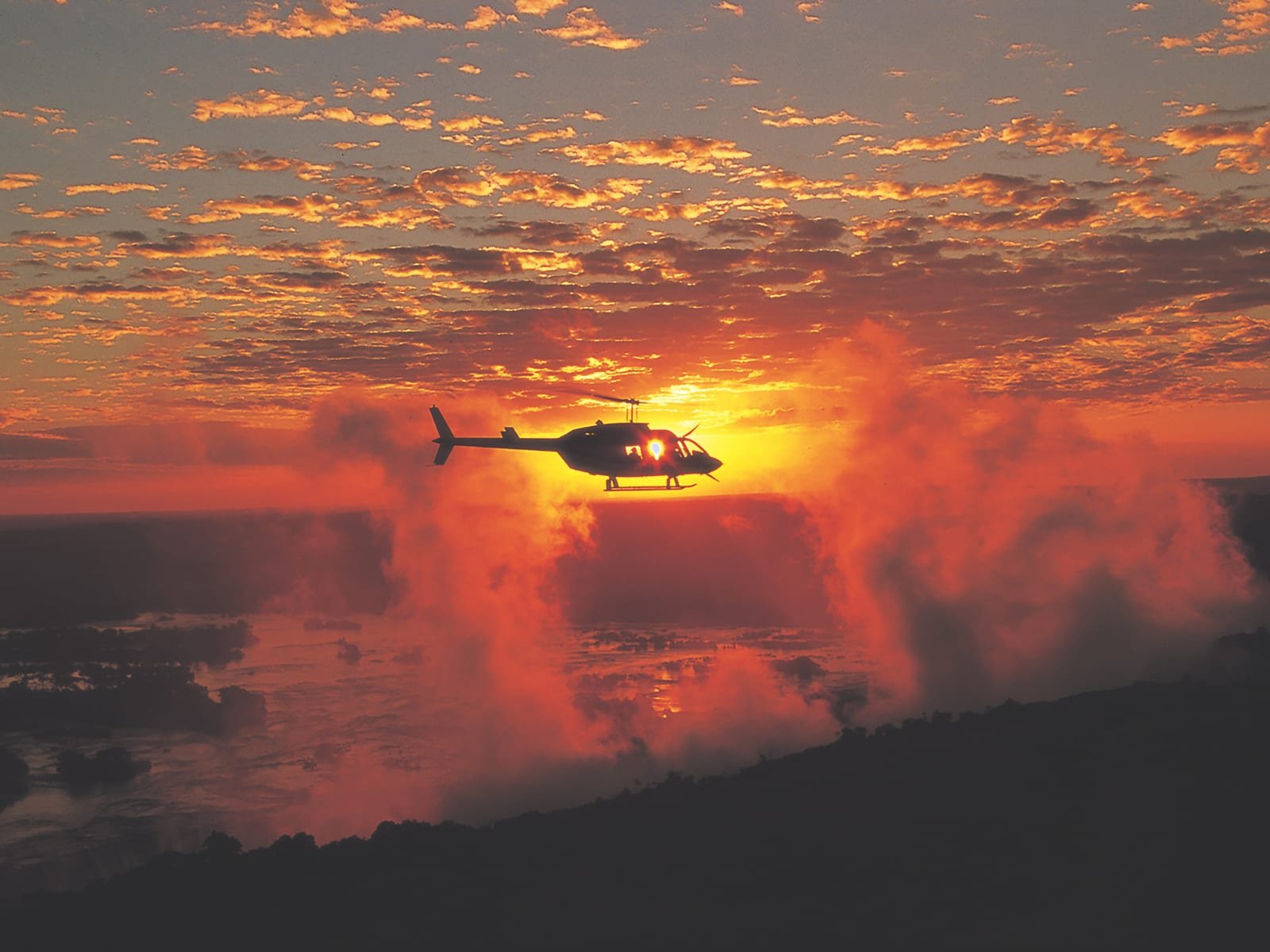 Helicopter flight over Victoria Falls at sunset